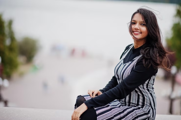 portrait-young-beautiful-indian-south-asian-teenage-girl-dress-against-river_627829-5371